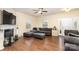 Living room featuring hardwood floors, fireplace, and ample natural light at 2548 Flintshire Ln, Gastonia, NC 28056