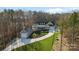 Stunning aerial view of a craftsman style home with a detached garage and landscaped yard at 324 Patternote Rd, Mooresville, NC 28117