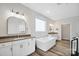 Luxurious bathroom with soaking tub and double vanity at 324 Patternote Rd, Mooresville, NC 28117