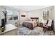 Cozy bedroom featuring a double bed and a sitting chair at 324 Patternote Rd, Mooresville, NC 28117