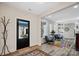 Bright entryway with black door and colorful rug at 324 Patternote Rd, Mooresville, NC 28117