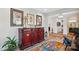 Elegant entryway with antique cabinet and colorful rug at 324 Patternote Rd, Mooresville, NC 28117