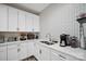 White kitchen with coffee bar and herringbone backsplash at 324 Patternote Rd, Mooresville, NC 28117