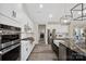 Modern kitchen with stainless steel appliances and large island with seating at 324 Patternote Rd, Mooresville, NC 28117