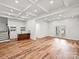 Finished basement with wet bar and hardwood floors at 3453 Selwyn Ave, Charlotte, NC 28209