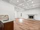 Finished basement with wet bar, fireplace, and wood-look flooring at 3453 Selwyn Ave, Charlotte, NC 28209