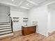 Finished basement with wet bar and stairs to upper level at 3453 Selwyn Ave, Charlotte, NC 28209