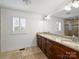 Double vanity bathroom with granite countertops and walk-in shower at 3453 Selwyn Ave, Charlotte, NC 28209