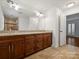 Double vanity bathroom with granite countertops and large mirror at 3453 Selwyn Ave, Charlotte, NC 28209