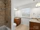 Bathroom with double vanity and shower/tub combo at 3453 Selwyn Ave, Charlotte, NC 28209