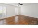 Spacious bedroom with hardwood floors and plantation shutters at 3453 Selwyn Ave, Charlotte, NC 28209