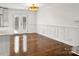 Bright dining room with hardwood floors and french doors leading outside at 3453 Selwyn Ave, Charlotte, NC 28209