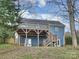 House back elevation with deck and stairs at 3453 Selwyn Ave, Charlotte, NC 28209