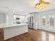 Modern kitchen with white cabinets, quartz countertops, and stainless steel appliances at 3453 Selwyn Ave, Charlotte, NC 28209