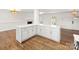 Modern kitchen island with white cabinets and quartz countertops at 3453 Selwyn Ave, Charlotte, NC 28209