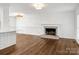 Bright living room with hardwood floors, fireplace, and large windows at 3453 Selwyn Ave, Charlotte, NC 28209