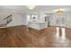 Open concept living space with hardwood floors and kitchen island at 3453 Selwyn Ave, Charlotte, NC 28209