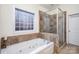 Bathroom with soaking tub and walk-in shower at 355 Sardis Rd N Alt Rd, Charlotte, NC 28270