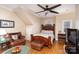 Cozy bedroom with a wooden bed frame and seating area at 355 Sardis Rd N Alt Rd, Charlotte, NC 28270