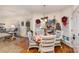 Bright breakfast nook with white wicker chairs and a round table at 355 Sardis Rd N Alt Rd, Charlotte, NC 28270