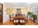 Elegant dining room with hardwood floors, chandelier, and large windows at 355 Sardis Rd N Alt Rd, Charlotte, NC 28270