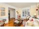 Living room with hardwood floors, fireplace, and comfortable seating at 355 Sardis Rd N Alt Rd, Charlotte, NC 28270