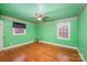 Bright bedroom with hardwood floors and ceiling fan at 4201 Westridge Dr, Charlotte, NC 28208