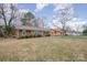 Front view of charming brick ranch home with yard at 4201 Westridge Dr, Charlotte, NC 28208