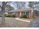 House exterior showcasing landscaping and walkway at 4201 Westridge Dr, Charlotte, NC 28208