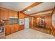 Open kitchen with wood cabinets and dining view at 4201 Westridge Dr, Charlotte, NC 28208