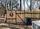 Wooden backyard fence with gate and wreath at 511 W Stevens Dr, Kershaw, SC 29067