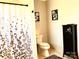 Clean bathroom with toilet and shower at 511 W Stevens Dr, Kershaw, SC 29067