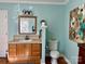 Bathroom with vanity, toilet and wood cabinet at 511 W Stevens Dr, Kershaw, SC 29067