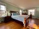 Main bedroom with king bed and wood floors at 511 W Stevens Dr, Kershaw, SC 29067