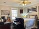 Spacious bedroom with a comfortable bed and a ceiling fan at 511 W Stevens Dr, Kershaw, SC 29067