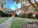 Charming single-story home featuring a brick facade, complemented by a stone pathway and well-manicured landscaping at 511 W Stevens Dr, Kershaw, SC 29067