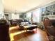 Sunlit living room with hardwood floors, fireplace and built-ins at 511 W Stevens Dr, Kershaw, SC 29067