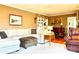 Living room with sectional sofa, built-in shelving, and hardwood floors at 511 W Stevens Dr, Kershaw, SC 29067