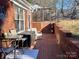 Brick patio with seating area and access to backyard at 511 W Stevens Dr, Kershaw, SC 29067