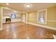 Open dining room with hardwood floors and kitchen view at 523 Fox Ave, Chester, SC 29706