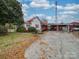 House with red roof, carport, and landscaping at 523 Fox Ave, Chester, SC 29706