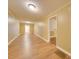 Long hallway with light walls and wood floors at 523 Fox Ave, Chester, SC 29706