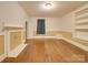 Living room with hardwood floors, built-in shelving and fireplace at 523 Fox Ave, Chester, SC 29706