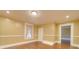 Spacious living room features hardwood floors and wainscoting at 523 Fox Ave, Chester, SC 29706