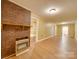 Living area with brick fireplace and wood floors at 523 Fox Ave, Chester, SC 29706