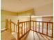 Wooden staircase overlooks the living room with a fireplace at 523 Fox Ave, Chester, SC 29706