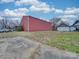 Large red metal workshop building in the backyard at 523 Fox Ave, Chester, SC 29706