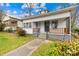 Quaint white bungalow home with a front porch at 526 S Green St, Statesville, NC 28677