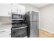 Stainless steel appliances and granite countertops in this kitchen at 526 S Green St, Statesville, NC 28677