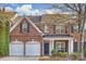 Brick front two-story home with two-car garage and landscaping at 8120 Oratorio Pl, Charlotte, NC 28270